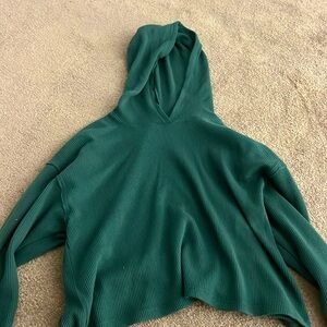 Green hooded sweater